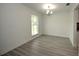 Bright dining room with hardwood floors and chandelier at 1638 Harmony Dr, Port Charlotte, FL 33952