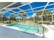 Inviting kidney-shaped pool with screened enclosure, offering a relaxing outdoor oasis at 16407 San Edmundo Rd, Punta Gorda, FL 33955