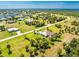 Aerial view highlighting the home's waterfront setting and neighborhood at 16407 San Edmundo Rd, Punta Gorda, FL 33955