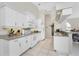 White kitchen cabinets, granite countertops and stainless steel appliances at 16407 San Edmundo Rd, Punta Gorda, FL 33955