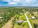 Aerial view of home on spacious lot with pool and canal access at 16407 San Edmundo Rd, Punta Gorda, FL 33955
