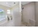 Bathroom with walk-in shower and soaking tub at 16407 San Edmundo Rd, Punta Gorda, FL 33955
