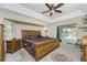 Spacious Primary bedroom with king-size bed and pool view at 16407 San Edmundo Rd, Punta Gorda, FL 33955