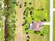 Aerial view of home with pool, canal access, and lush landscaping at 16407 San Edmundo Rd, Punta Gorda, FL 33955