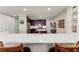 Modern kitchen with dark wood cabinets and a breakfast bar at 89 Vivante Blvd # 305, Punta Gorda, FL 33950