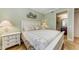 Guest bedroom with coastal decor and en-suite bathroom at 89 Vivante Blvd # 305, Punta Gorda, FL 33950