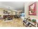 Open dining area with a round table, chairs, and views into the living room at 89 Vivante Blvd # 305, Punta Gorda, FL 33950