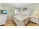 Guest bedroom with coastal decor and en-suite bathroom at 89 Vivante Blvd # 305, Punta Gorda, FL 33950
