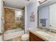 Updated bathroom with a tiled shower/tub combo and granite countertop at 89 Vivante Blvd # 305, Punta Gorda, FL 33950