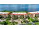 Waterfront condo building with lush landscaping and parking at 89 Vivante Blvd # 305, Punta Gorda, FL 33950