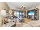 Spacious living room with comfortable seating, large TV, and access to a balcony with water views at 89 Vivante Blvd # 305, Punta Gorda, FL 33950