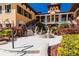 Charming courtyard with fountain and lush landscaping at 89 Vivante Blvd # 305, Punta Gorda, FL 33950