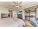 Main bedroom with access to a balcony and water views at 89 Vivante Blvd # 305, Punta Gorda, FL 33950