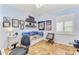 Cozy bedroom with a daybed, shelving, and tiled floor at 89 Vivante Blvd # 305, Punta Gorda, FL 33950