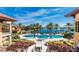 Inviting pool area with lake views at 89 Vivante Blvd # 305, Punta Gorda, FL 33950