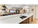 Modern kitchen with sink and views into living area at 89 Vivante Blvd # 305, Punta Gorda, FL 33950
