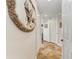 Bright hallway with tile flooring and neutral walls at 89 Vivante Blvd # 305, Punta Gorda, FL 33950