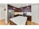 Modern kitchen with island and stainless steel appliances at 89 Vivante Blvd # 305, Punta Gorda, FL 33950