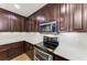 Modern kitchen with stainless steel appliances and ample counter space at 89 Vivante Blvd # 305, Punta Gorda, FL 33950