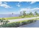 Scenic waterfront view with palm trees and blue sky at 1500 Park Beach Cir # 2F, Punta Gorda, FL 33950