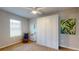 Cozy bedroom features carpet flooring, a ceiling fan, and a large built-in wardrobe at 25168 E Lenox Cir, Punta Gorda, FL 33950