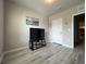 Living room with laminate floor, ceiling fan, recessed lighting, and a door at 25168 E Lenox Cir, Punta Gorda, FL 33950