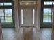 Welcoming entryway featuring tile flooring, abundant natural light, and a seamless transition to living spaces at 8347 Ada St, Port Charlotte, FL 33981
