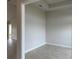 Comfortable living room featuring tile floors, neutral paint, and bright natural light from nearby windows at 8347 Ada St, Port Charlotte, FL 33981