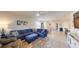 Open living room showcasing a comfortable sectional sofa and access to the backyard at 25168 E Lenox Cir, Punta Gorda, FL 33950