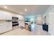 Modern kitchen with stainless steel appliances and white cabinetry at 25168 E Lenox Cir, Punta Gorda, FL 33950