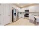 Modern kitchen with white cabinets and stainless steel appliances at 25168 E Lenox Cir, Punta Gorda, FL 33950