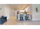 Modern kitchen with white cabinets, stainless steel appliances, and breakfast bar at 25168 E Lenox Cir, Punta Gorda, FL 33950