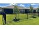 Private backyard with a black metal fence at 25168 E Lenox Cir, Punta Gorda, FL 33950