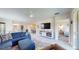 Living room with comfortable sectional sofa and access to bedroom at 25168 E Lenox Cir, Punta Gorda, FL 33950