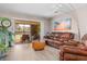 Living room with sliding doors leading to a balcony at 754 Avenida Estancia # 160, Venice, FL 34292