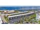 Aerial view of waterfront condo building with parking and nearby pool at 150 Harborside Ave # 216, Punta Gorda, FL 33950