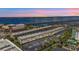 Aerial view of waterfront condo building with parking and nearby bridge at 150 Harborside Ave # 216, Punta Gorda, FL 33950