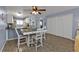 Dining area with table and chairs, open to kitchen and living room at 150 Harborside Ave # 216, Punta Gorda, FL 33950