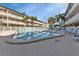 Enjoy this sparkling community pool with surrounding lounge chairs at 150 Harborside Ave # 216, Punta Gorda, FL 33950