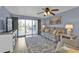 Relaxing living room with hardwood floors, large window, and comfortable seating at 150 Harborside Ave # 216, Punta Gorda, FL 33950