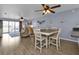 Dining area with table and chairs, kitchen and living room access at 150 Harborside Ave # 216, Punta Gorda, FL 33950