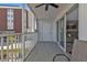 Screened balcony with seating and partial view of the building at 150 Harborside Ave # 216, Punta Gorda, FL 33950