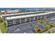 Aerial view of waterfront condo building with parking and landscaping at 150 Harborside Ave # 216, Punta Gorda, FL 33950