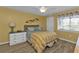 Bright bedroom with striped bedding, wood floors and lots of light at 150 Harborside Ave # 216, Punta Gorda, FL 33950