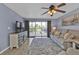 Living room with hardwood floors, balcony access, and comfortable seating at 150 Harborside Ave # 216, Punta Gorda, FL 33950