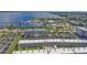 Aerial view of waterfront condo community with pool and parking at 150 Harborside Ave # 216, Punta Gorda, FL 33950