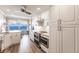 Modern kitchen with white cabinets, stainless steel appliances and a breakfast nook at 200 Harbor Walk Dr # 243, Punta Gorda, FL 33950