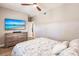 Serene bedroom featuring a comfortable bed, mounted TV, and dresser at 200 Harbor Walk Dr # 243, Punta Gorda, FL 33950