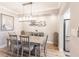 Elegant dining room features a large table and chandelier, hardwood floors, and recessed lighting at 200 Harbor Walk Dr # 243, Punta Gorda, FL 33950