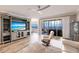 Living area boasts water views, hardwood floors, and relaxing seating at 200 Harbor Walk Dr # 243, Punta Gorda, FL 33950